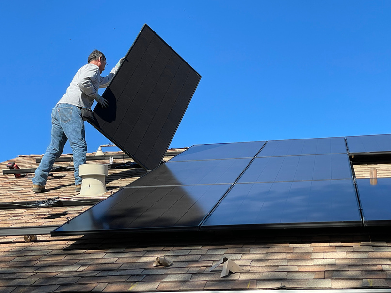 Man Installing Solar Panels 